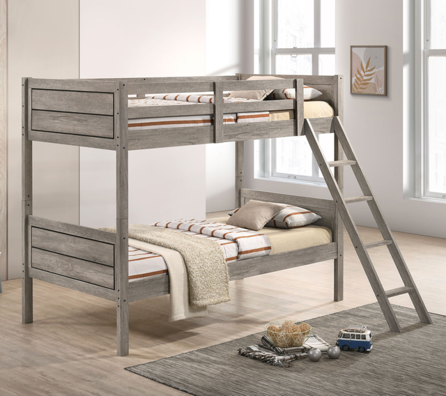 A bunk bed with a ladder attached to it in a bedroom.