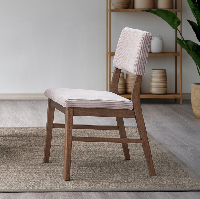 A chair is sitting on a rug in a living room