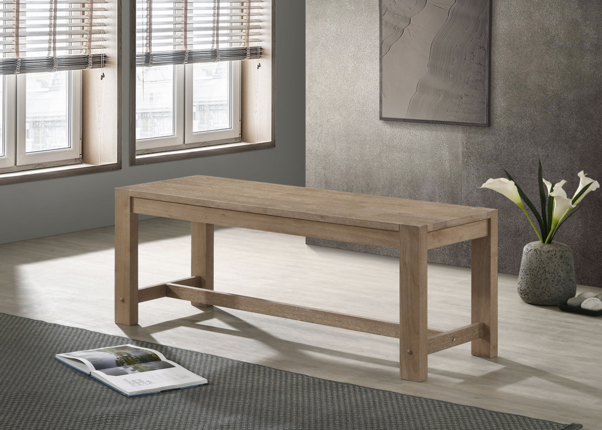 A wooden bench is sitting in a living room next to a window.