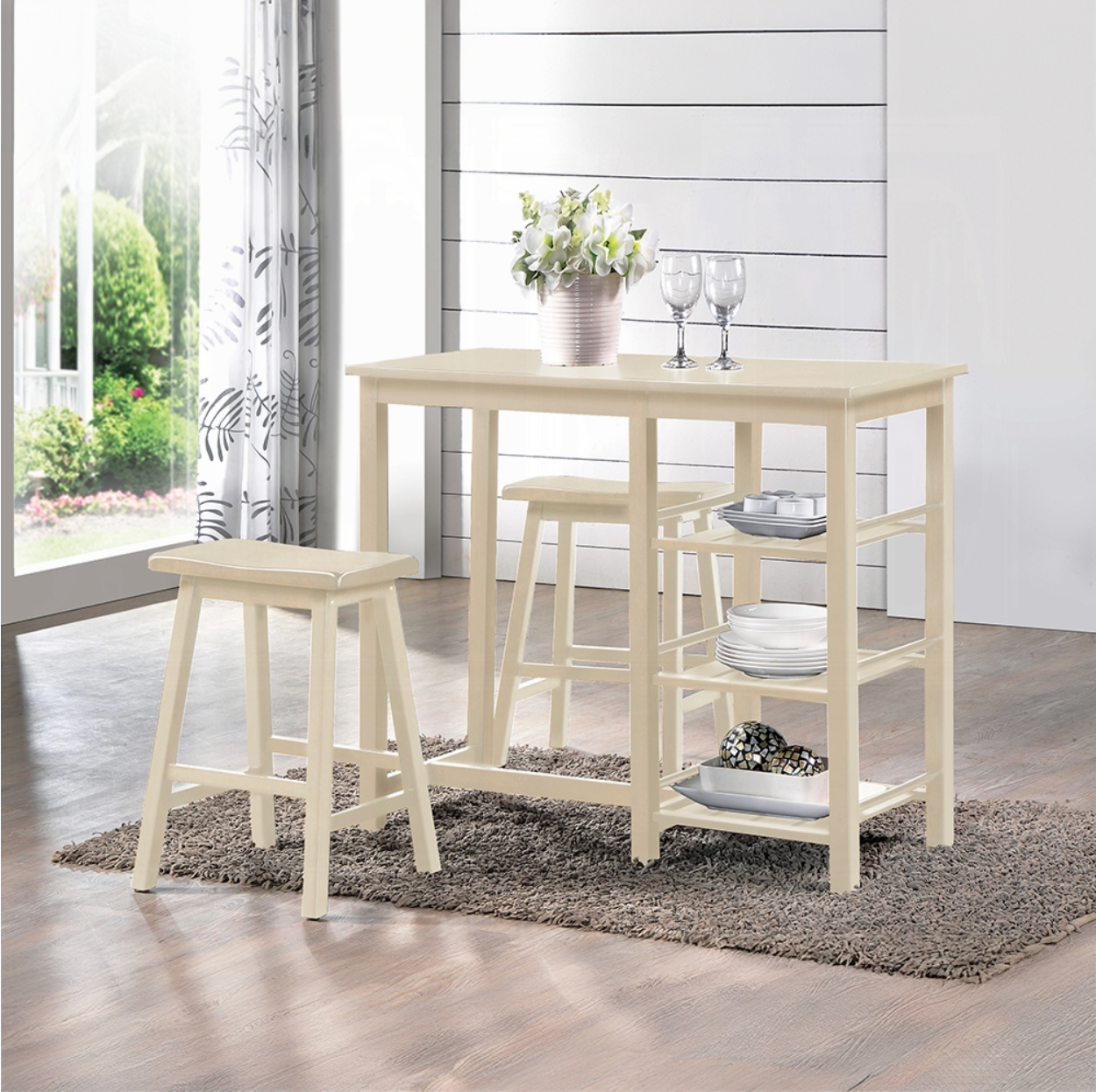 A table with two stools and a vase of flowers on it
