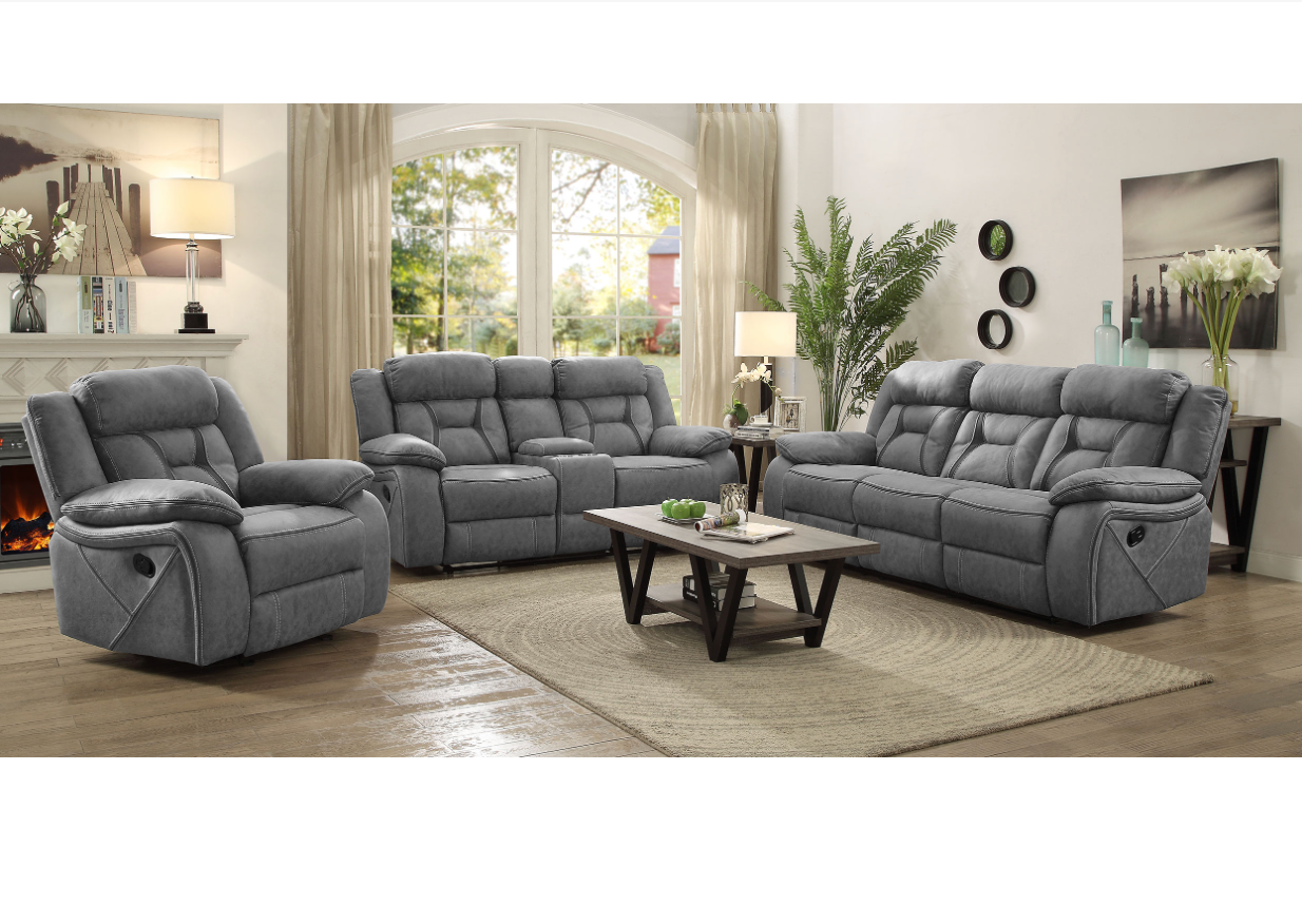 A living room with a couch , two chairs , and a coffee table.