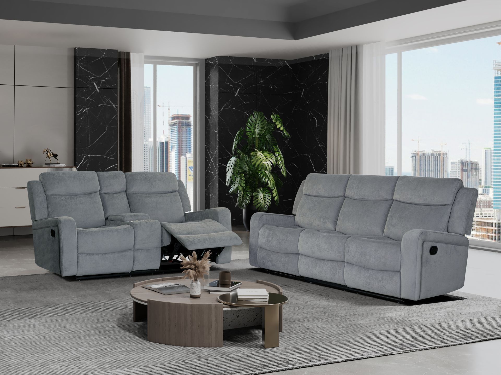 A living room with two black leather reclining couches and a rug.