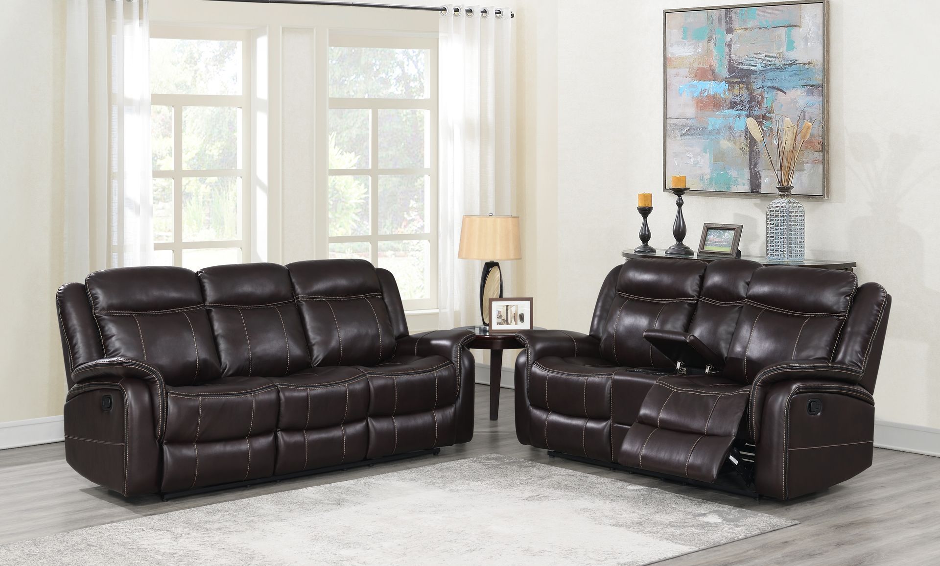 A living room filled with furniture and a painting on the wall.