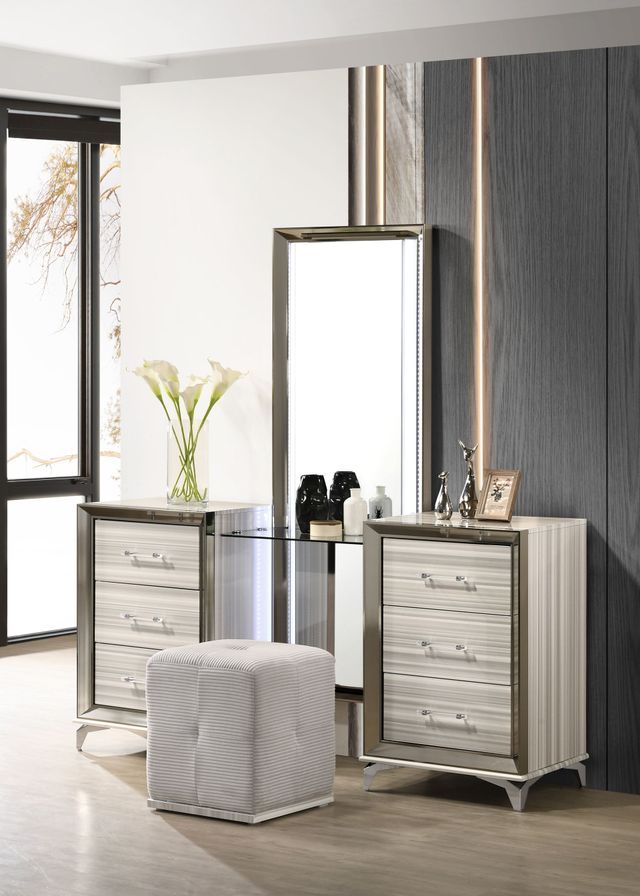A bedroom with a dresser , mirror and ottoman