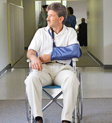 Man in wheel chair with injured hand