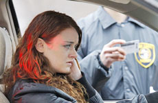 Officer checking woman's driving license