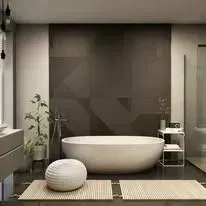 A bathroom with a bathtub, sink, and shower.
