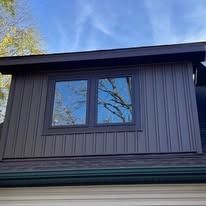 There is a window on the side of the house.