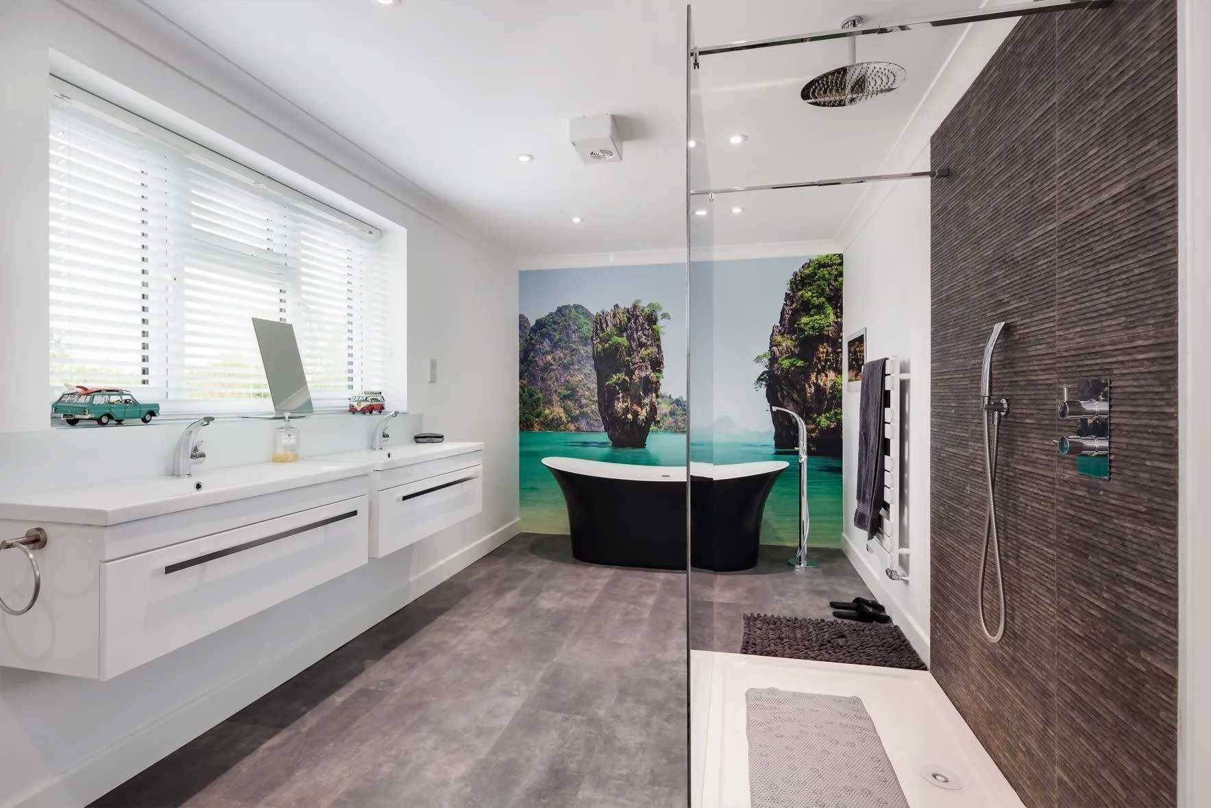 Modern bathroom with a double sink vanity, a black tub, and a large shower.