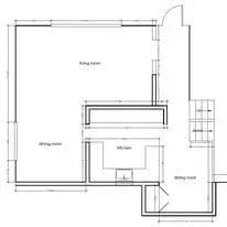 Floor plan of a building with a living room, kitchen, and dining room, with a staircase.