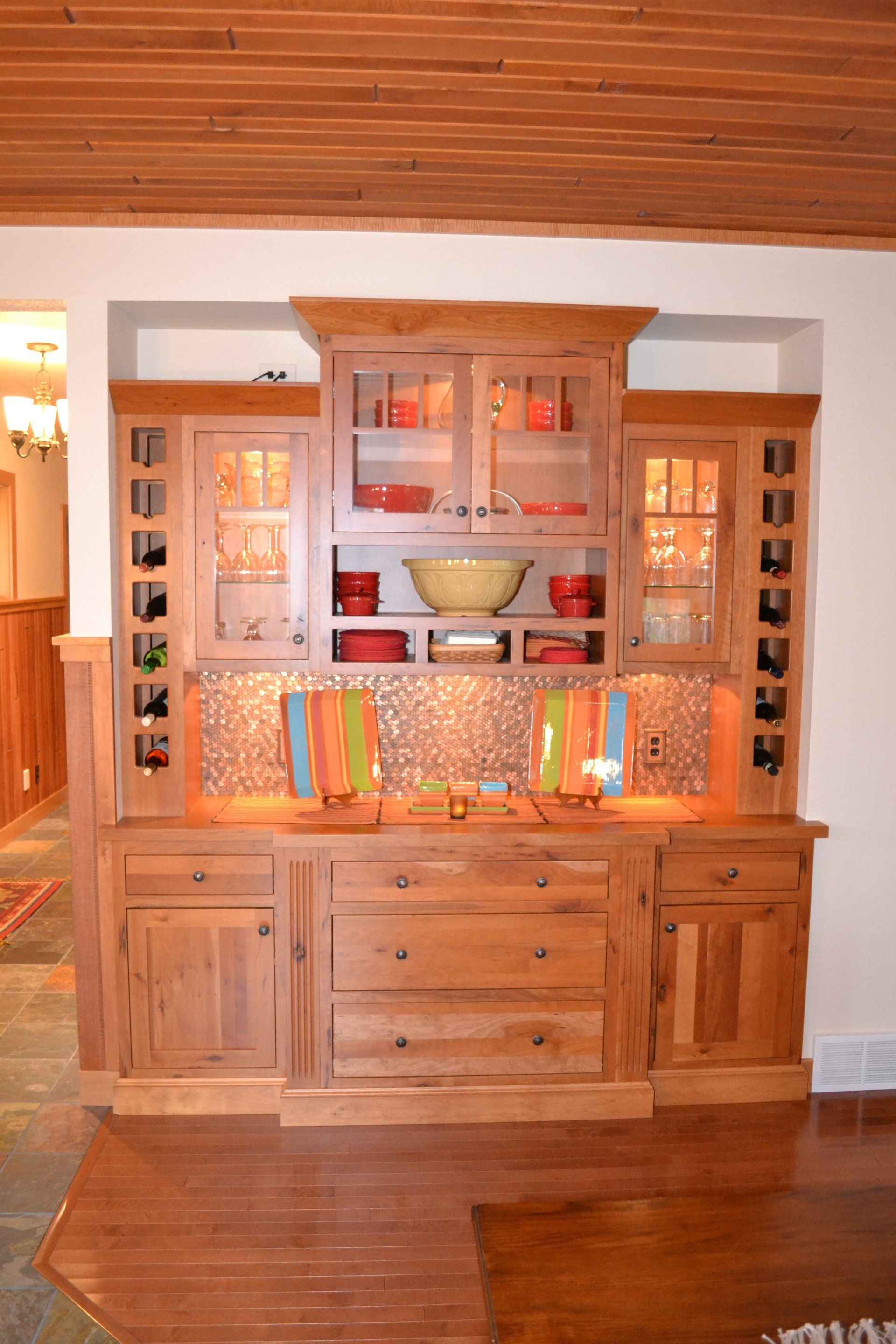 A wooden cabinet with a bowl on top of it
