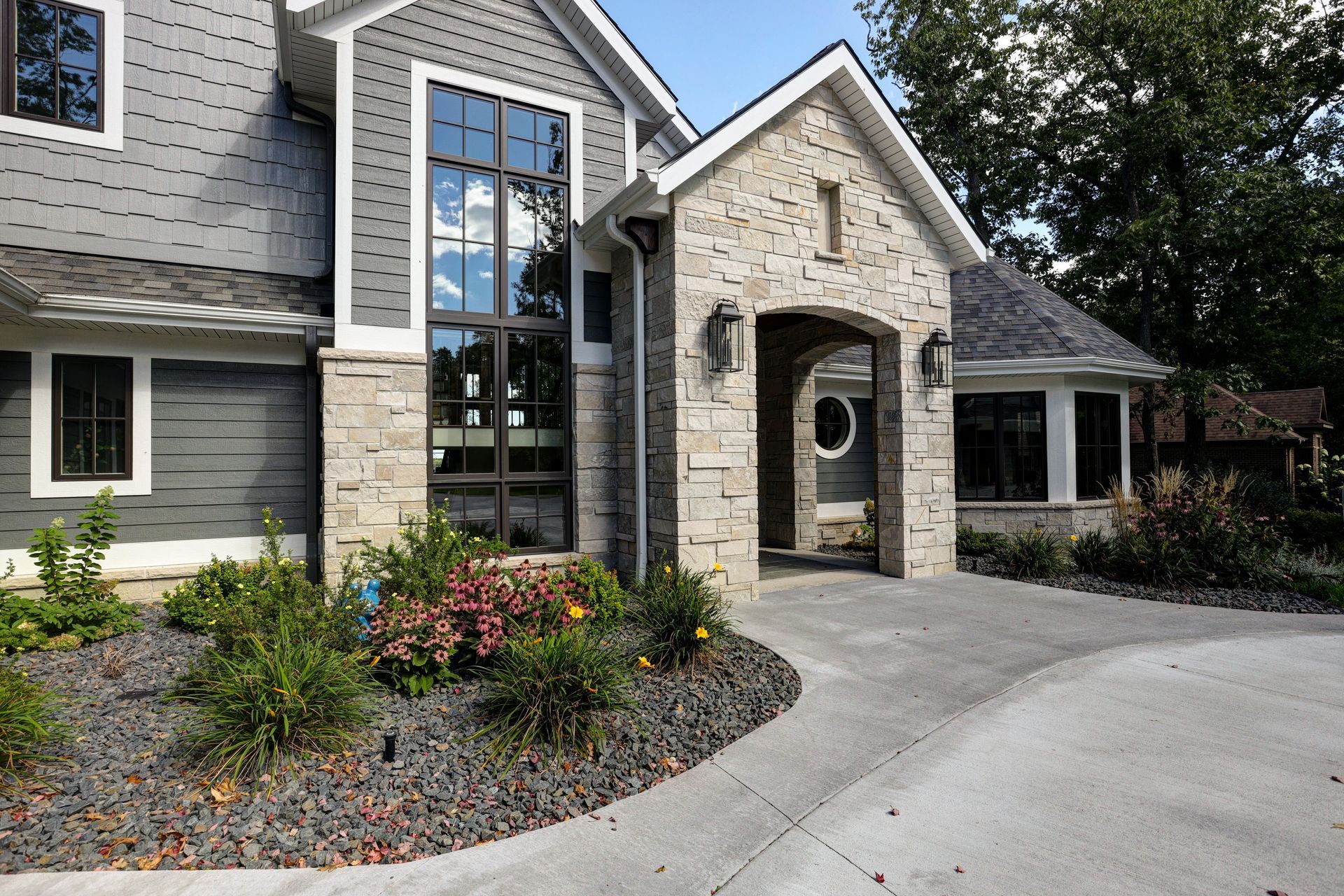 A large house with a driveway leading to it