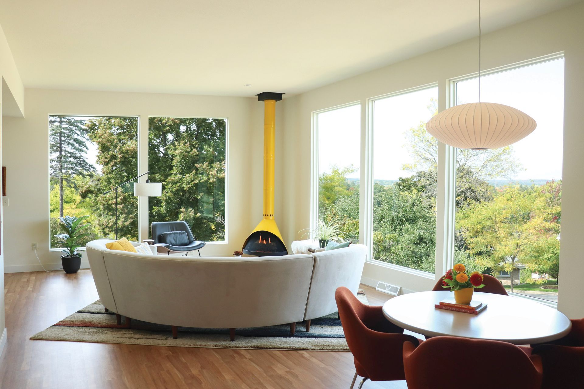 A living room with a white couch and a yellow fireplace