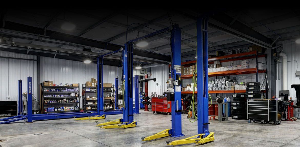 A garage with a lot of lifts in it.