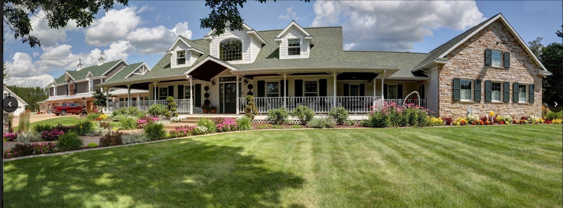 A large house with a large lawn in front of it