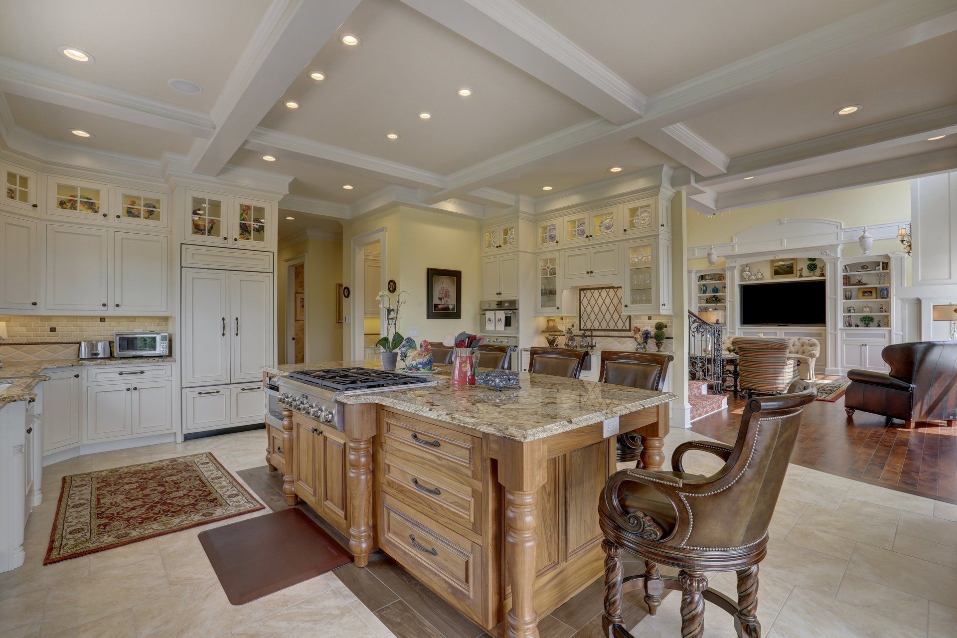 There is a large island in the middle of the kitchen.