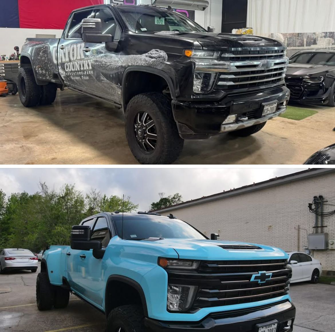 A black truck and a blue truck are parked next to each other