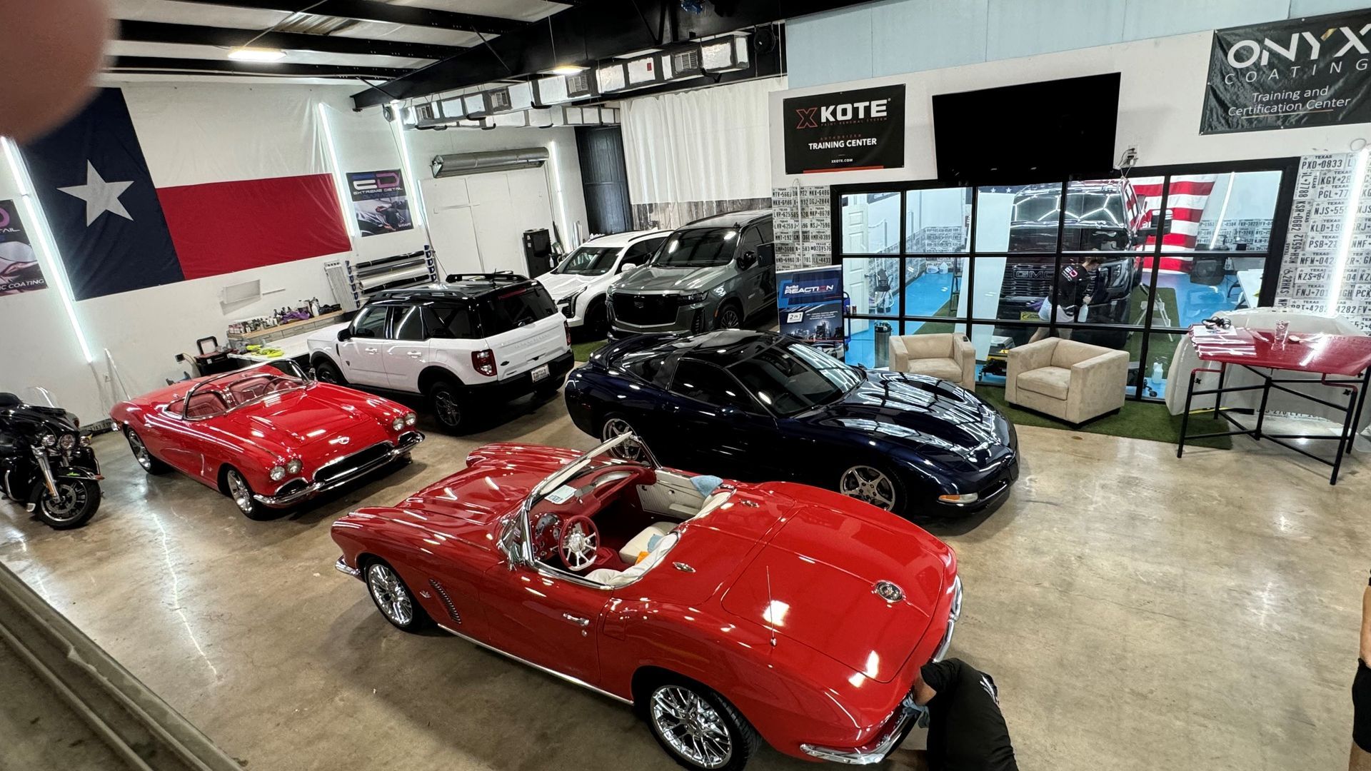 A lot of cars are parked in a garage.