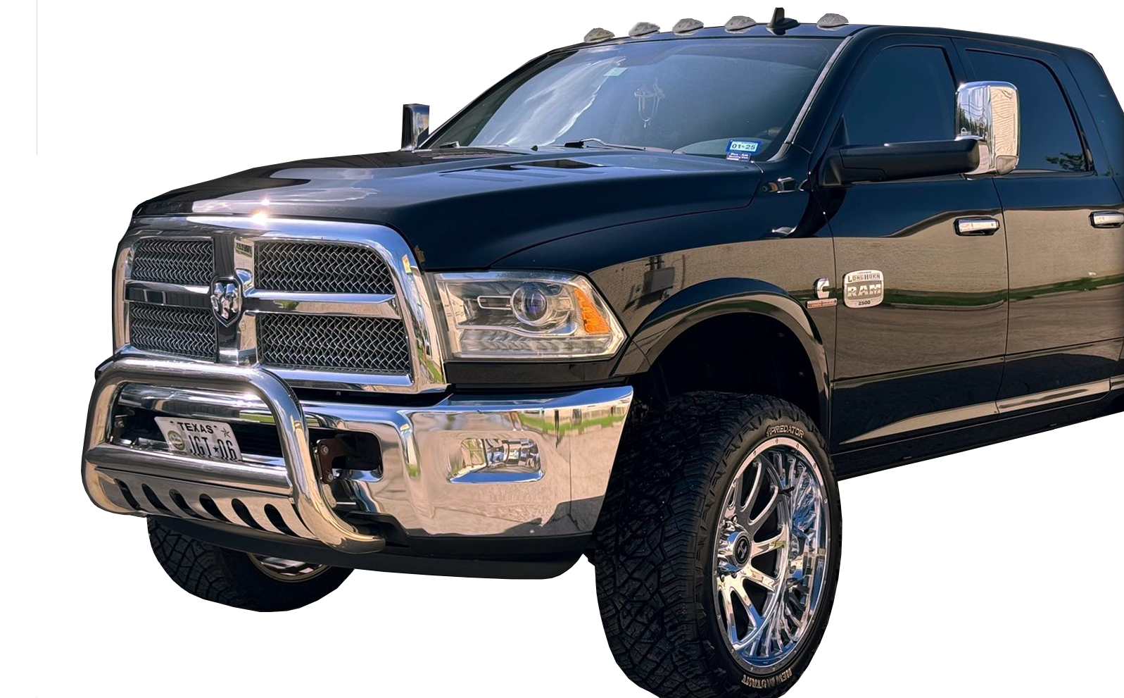 A black dodge ram truck is parked on a white background.