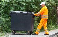 Man Pulling dumpster