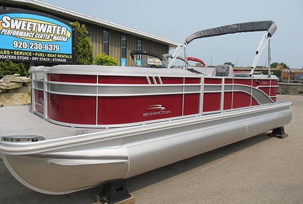 Red and silver pontoon boat on display at Sweetwater Performance Marine.