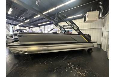 Gray pontoon boat inside a building.