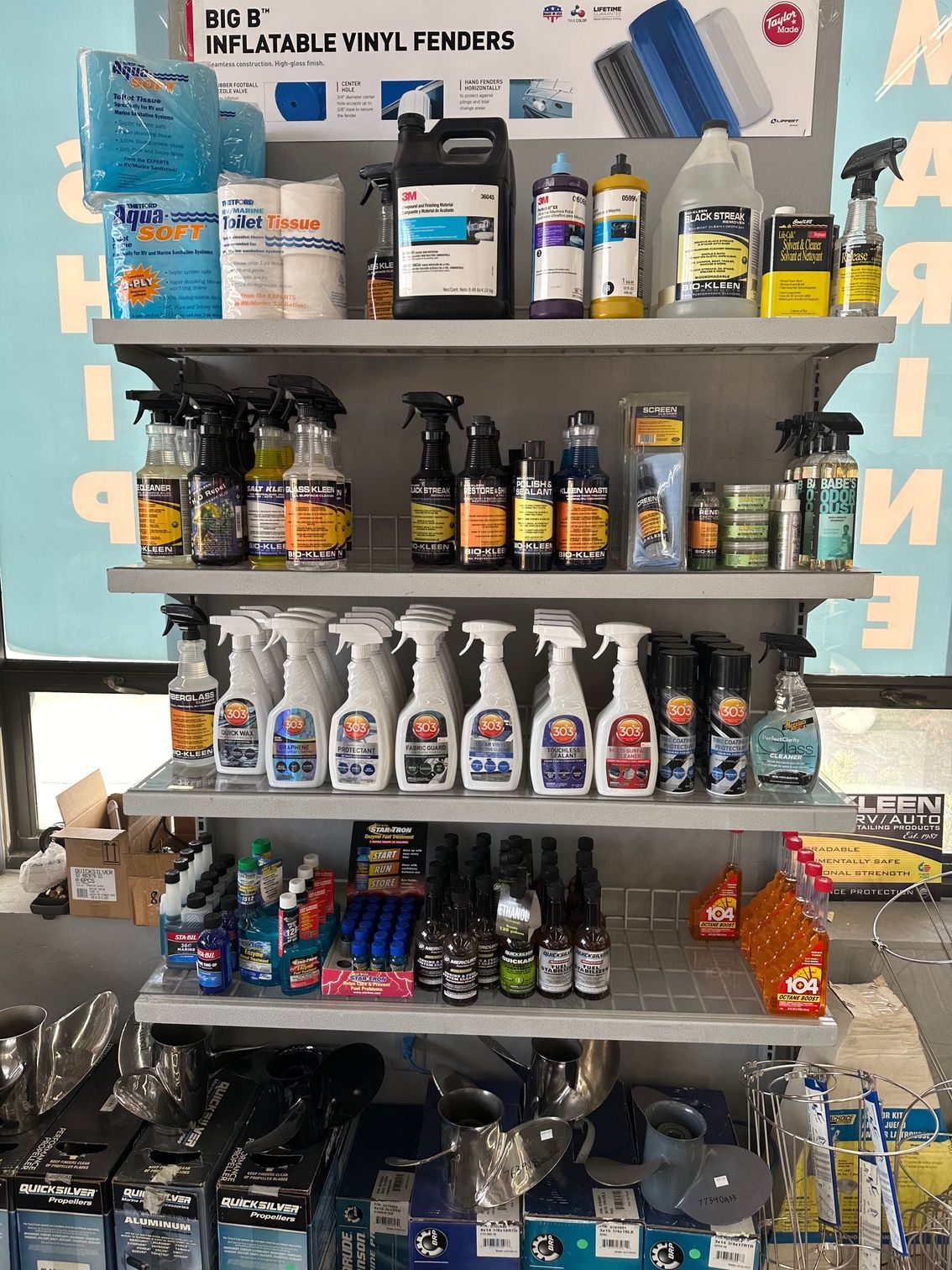 Shelves stocked with various cleaning and maintenance products in a retail store.