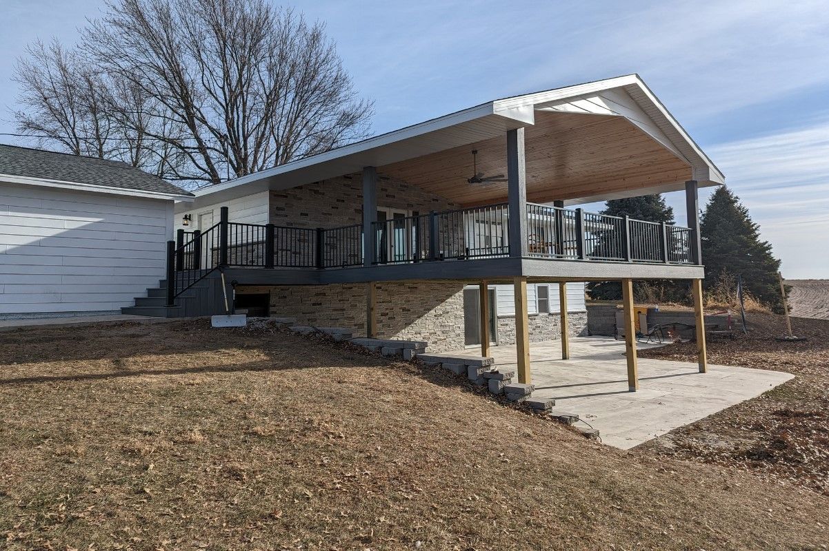 A house with a large deck and a covered porch