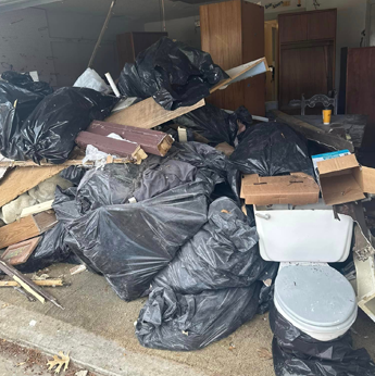 bags of garbage in a room