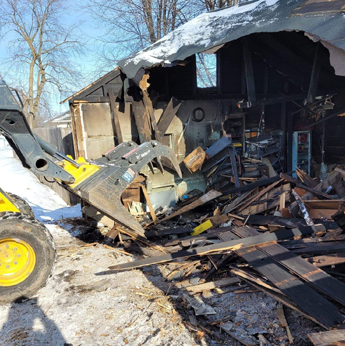 run down house with garbage laying around