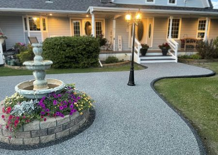 A house with a fountain in front of it