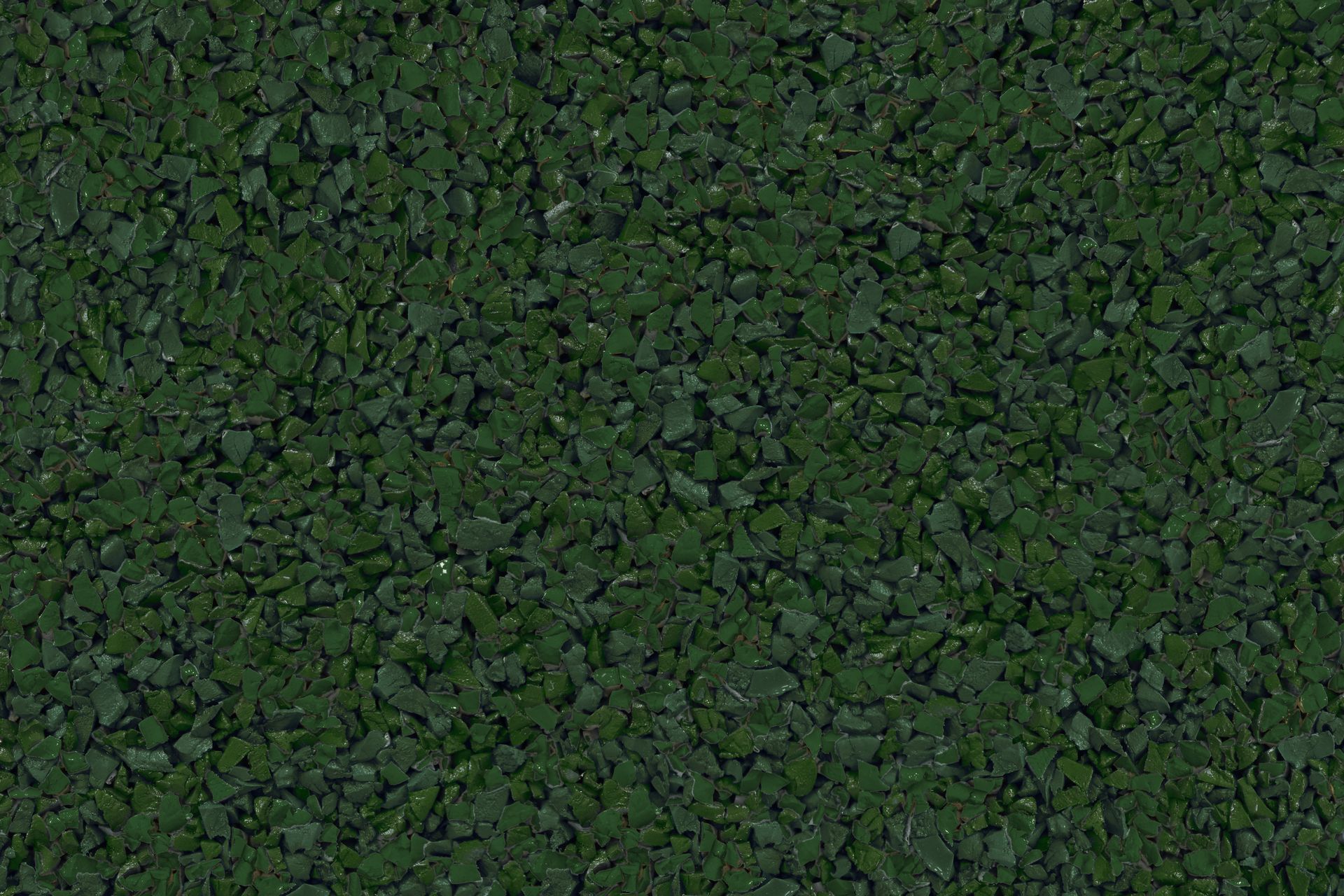 A close up of a pile of green gravel.