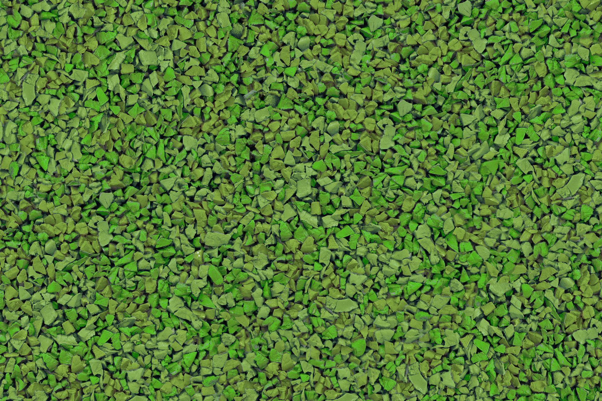 A close up of a pile of green gravel.