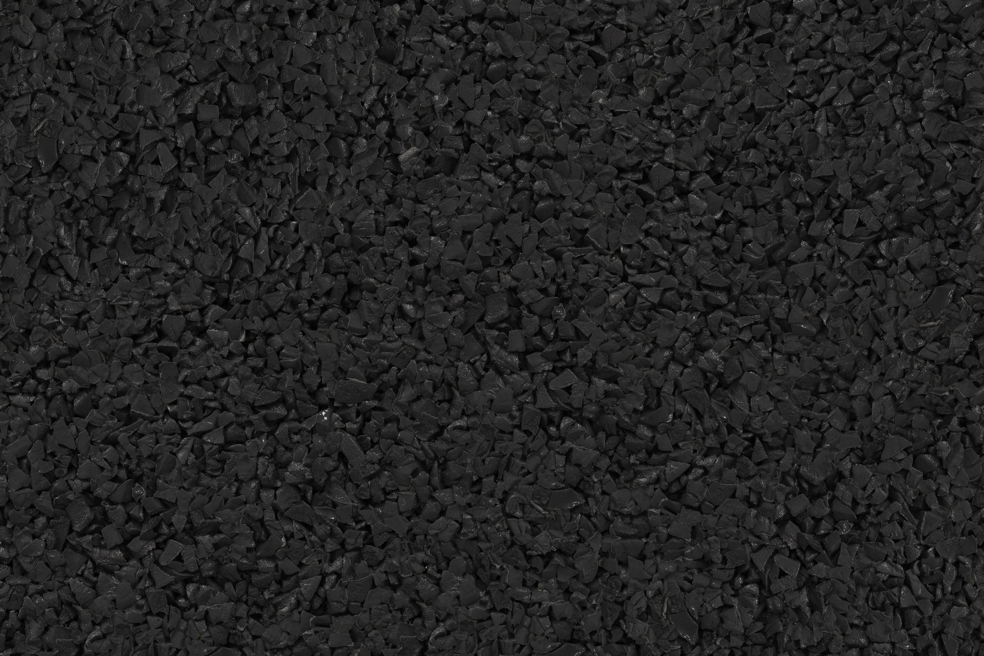 A close up of a pile of black gravel.