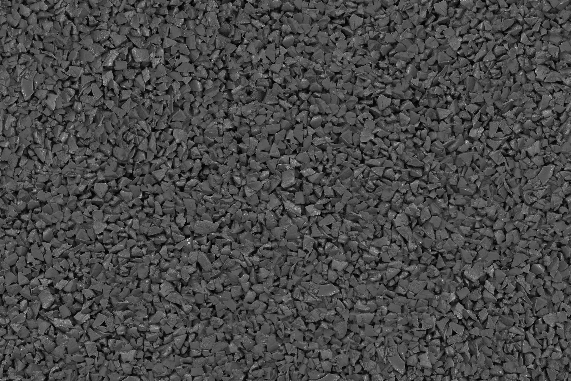 A close up of a pile of black gravel.