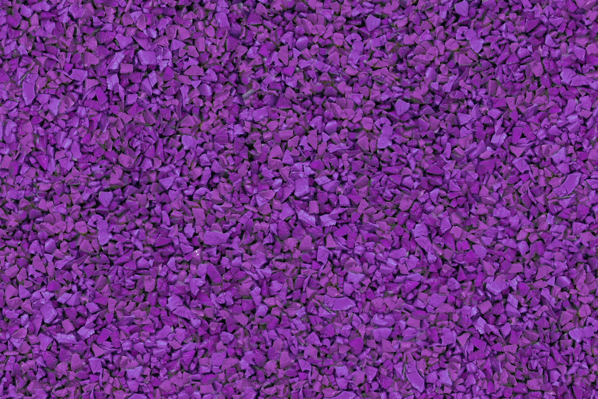 A close up of a pile of purple gravel.