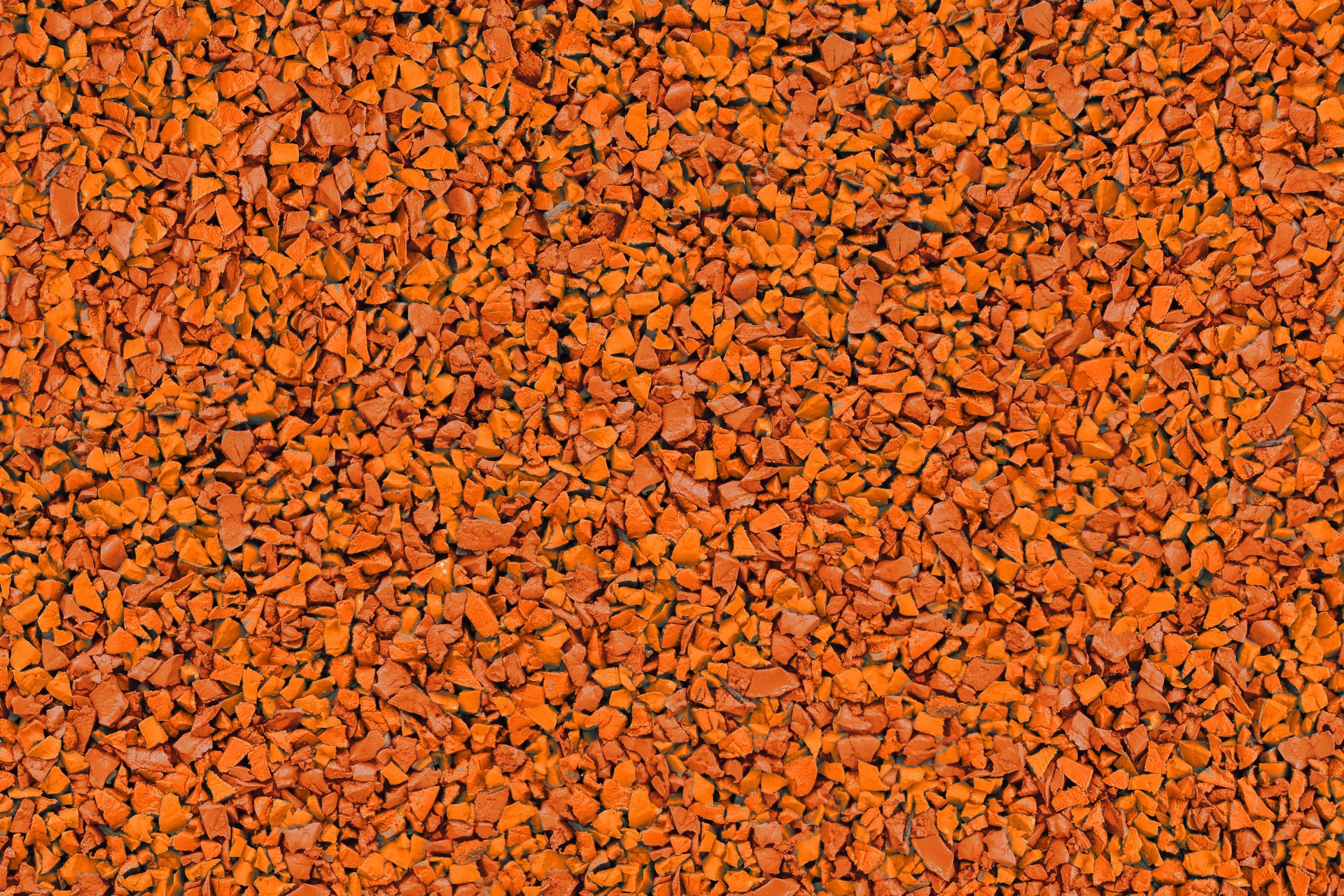 A close up of a pile of orange gravel.