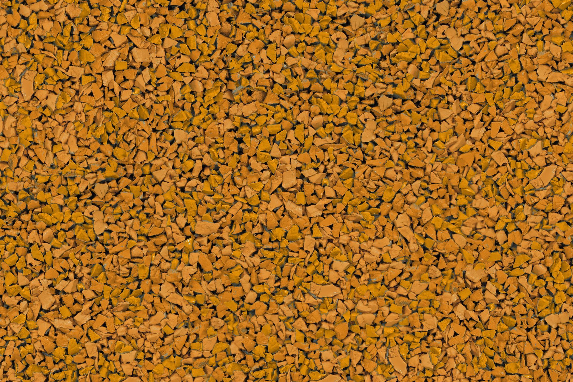 A close up of a pile of brown gravel.