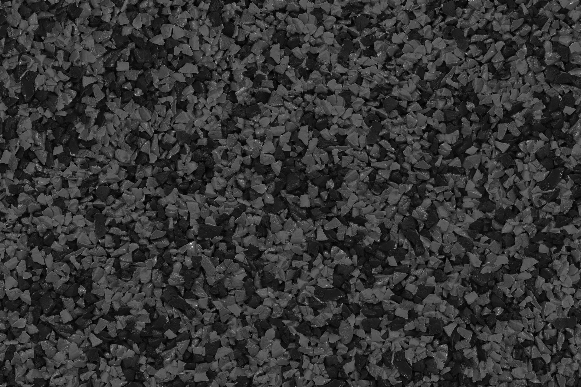 A close up of a pile of black gravel.