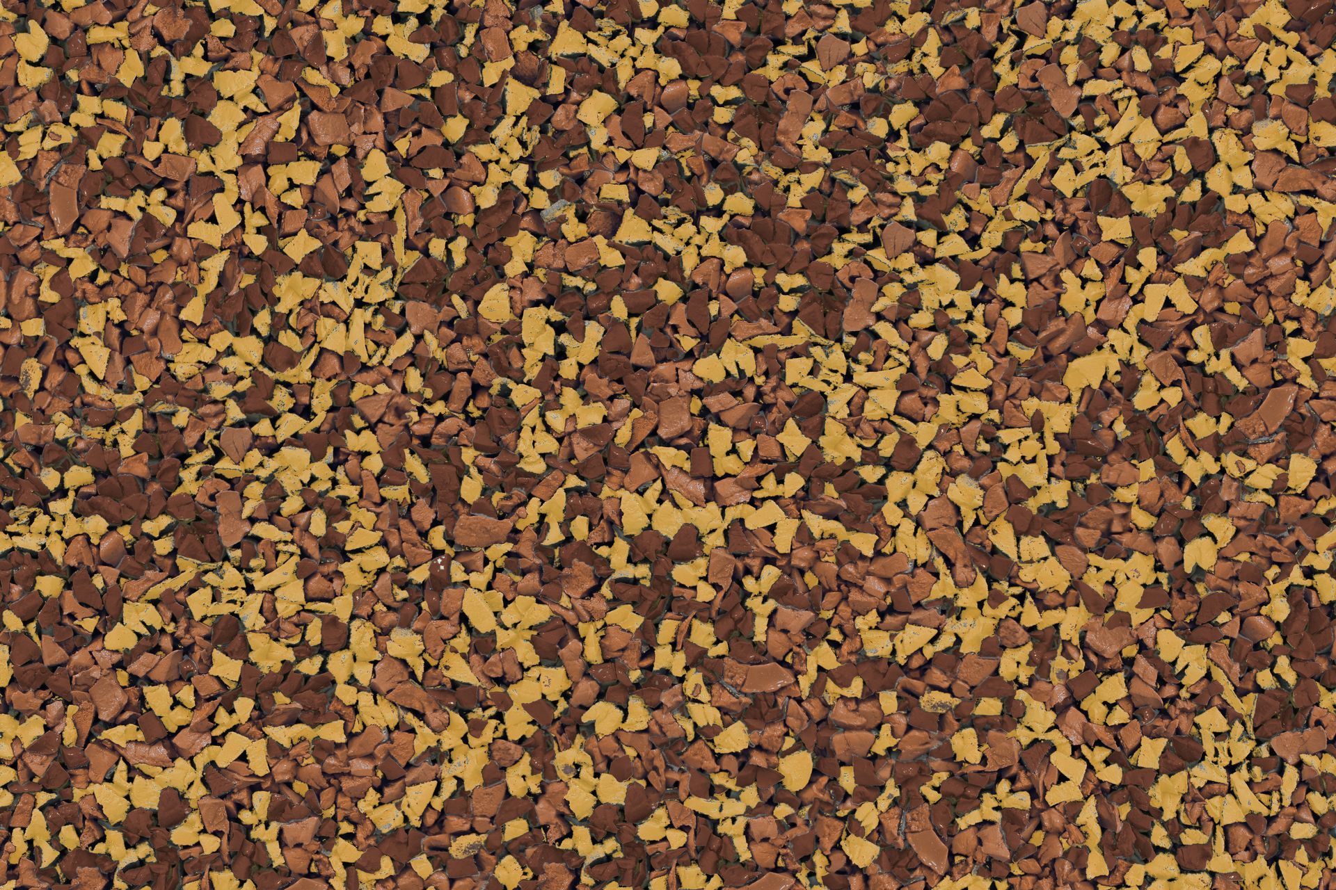 A close up of a brown and yellow rubber surface.