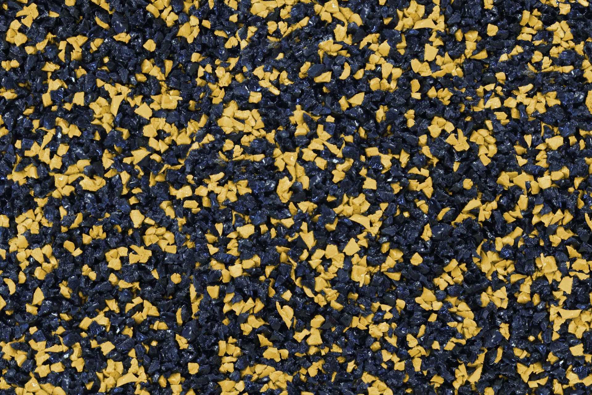 A close up of a black and yellow rubber surface.