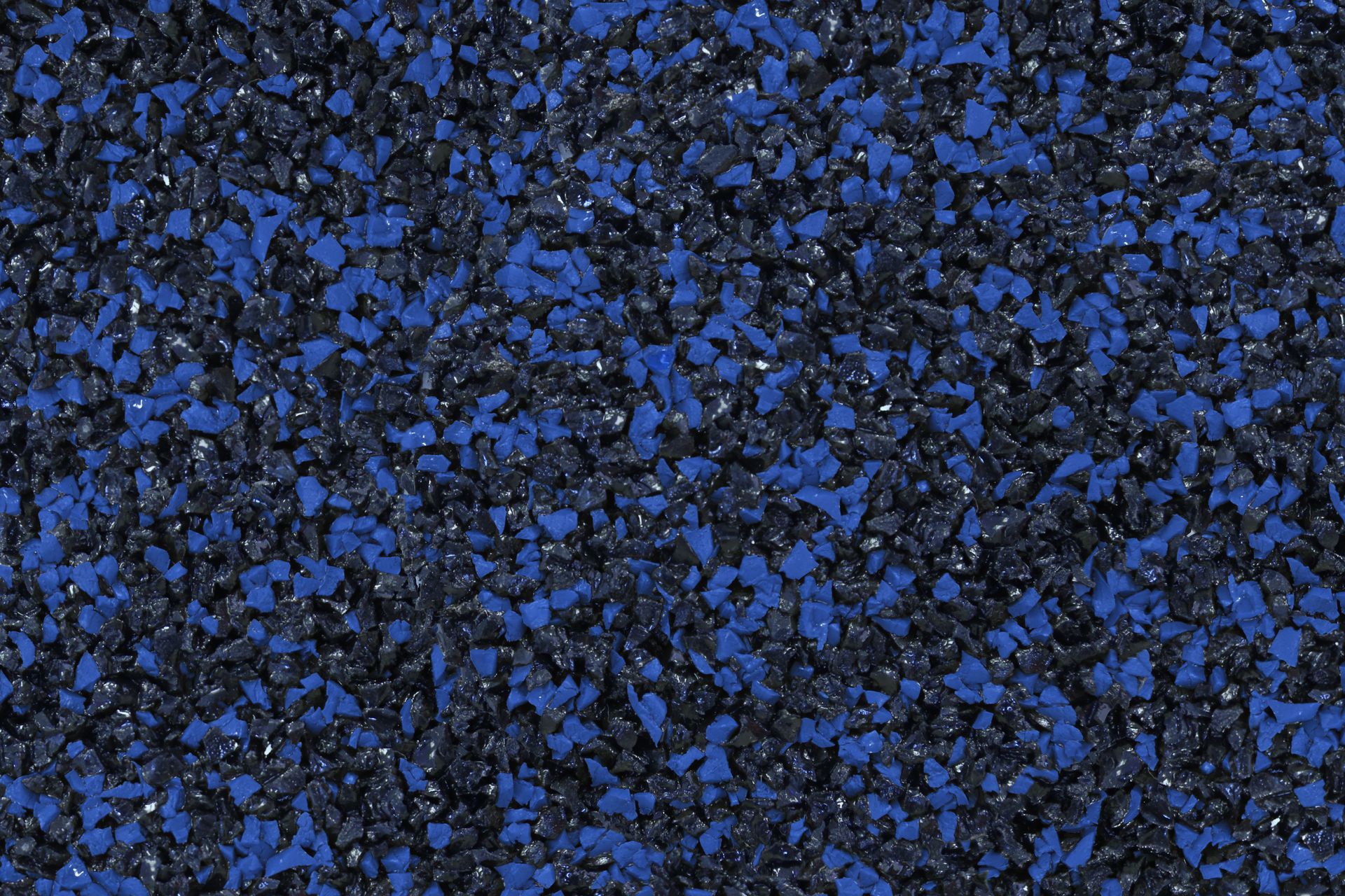 A close up of a blue and black carpet texture.