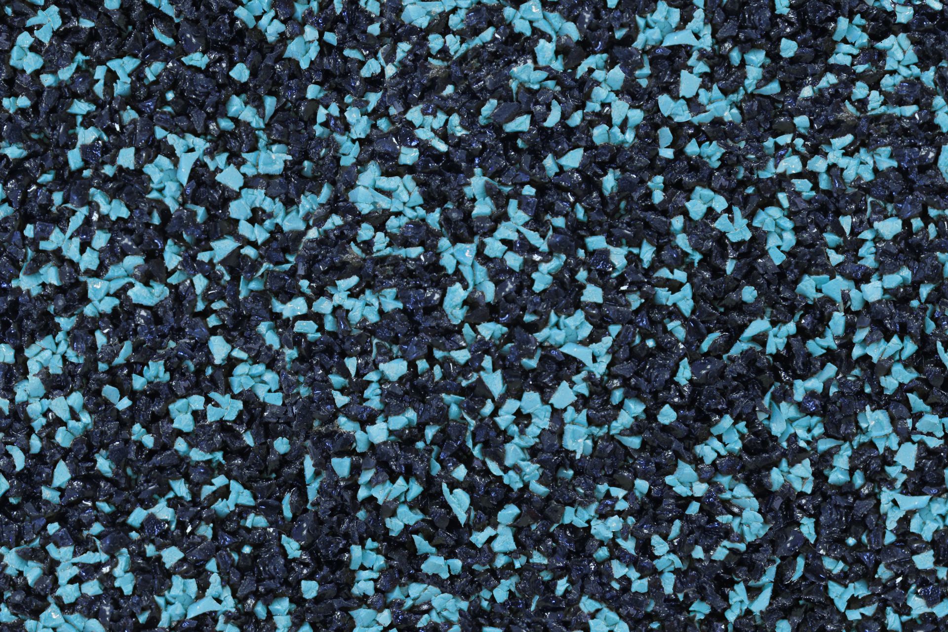 A close up of a black and blue rubber surface.
