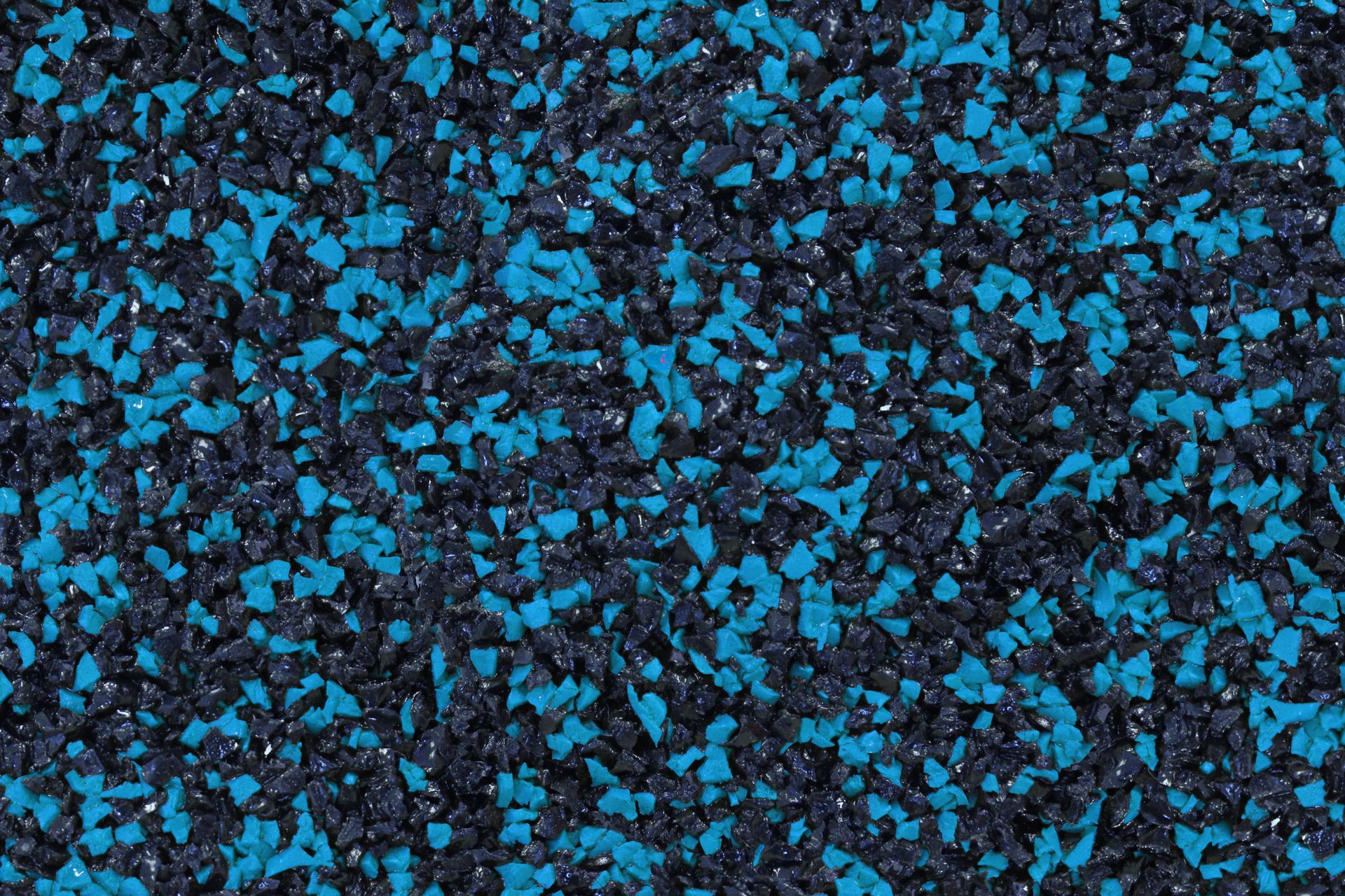 A close up of a blue and black rubber surface.