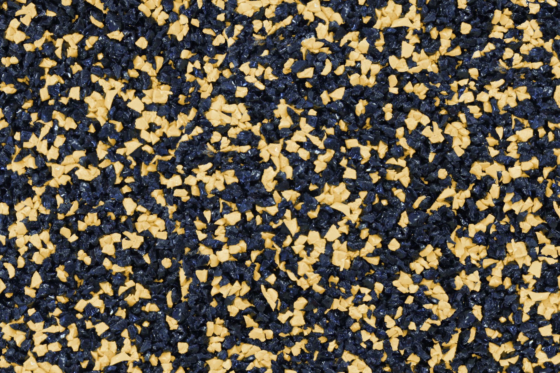 A close up of a black and yellow rubber surface.