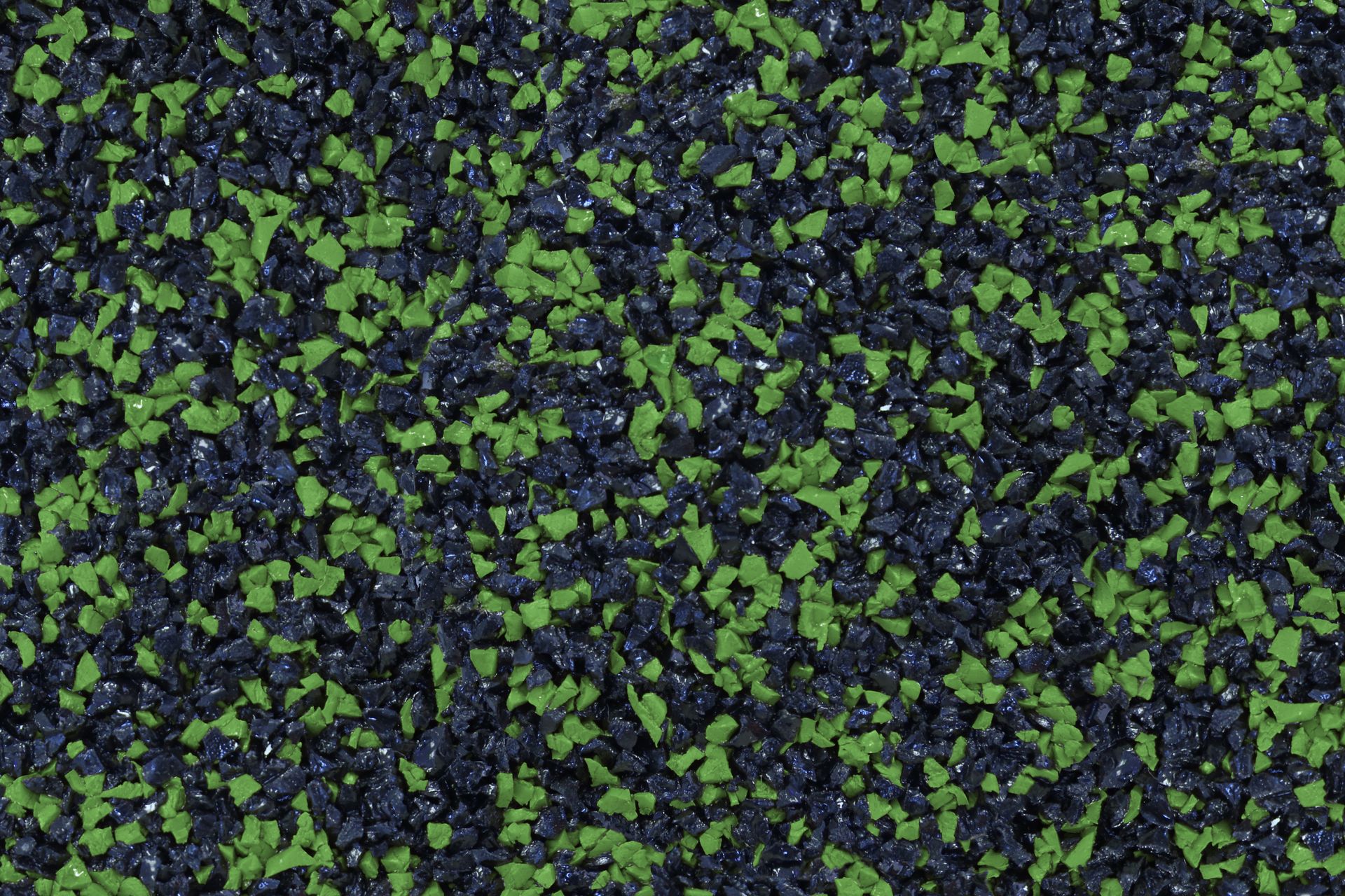 A close up of a green and black carpet texture.