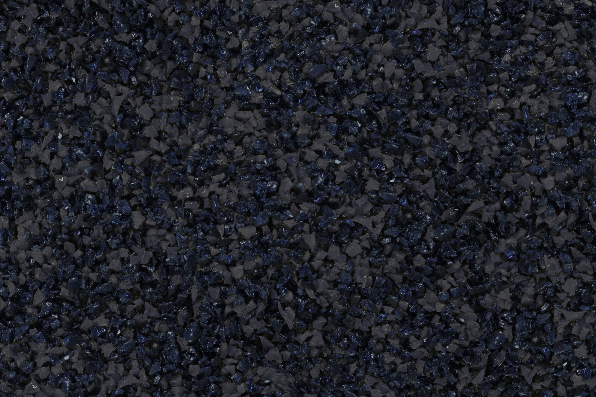 A close up of a pile of black gravel.