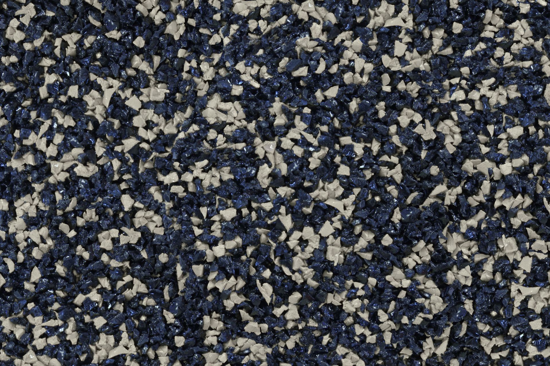 A close up of a blue and white carpet texture.