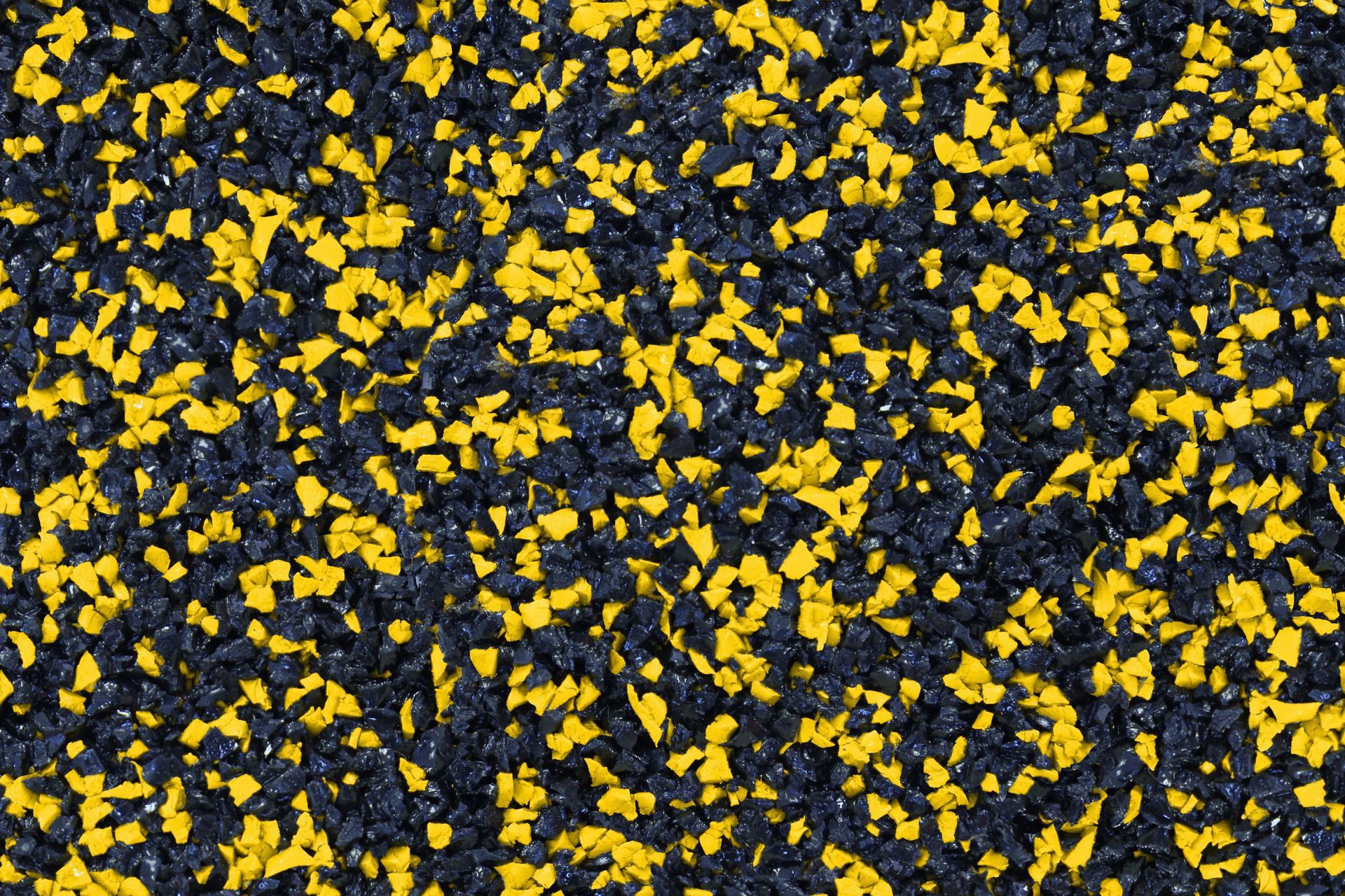 A close up of a black and yellow rubber surface.