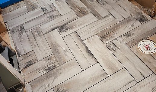 Rustic wood-patterned tabletop with a coaster in the corner
